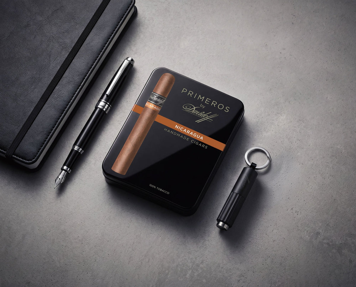 A Primeros by Davidoff cigar resting beside an espresso
