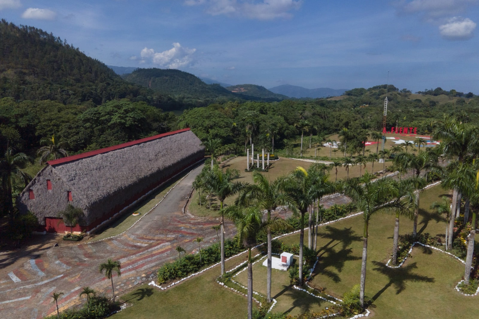 Aerial view of the Chateau de la Fuente estate in the Dominican Republic with its curing barn and the red A. Fuente sign